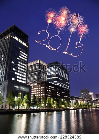 2015 New Year Fireworks celebrating over Tokyo cityscape at night, Japan