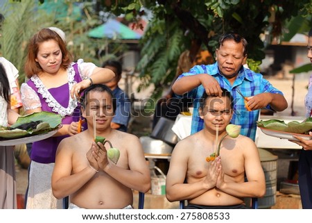 NAKHON RATCHASIMA, THAILAND-APRIL 12: Male who will be monk cut hair for be Ordained to new monk on April 12, 2015 in the Chae Temple,Nakhon Ratchasima,Thailand