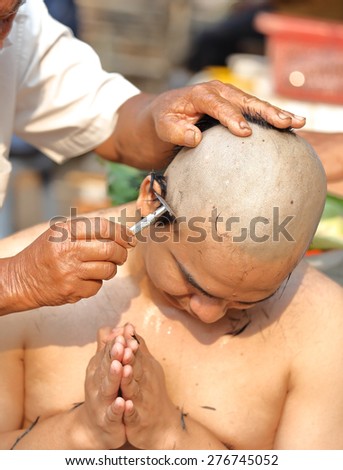 Male who will be monk shaving hair for be Ordained to new monk