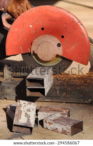 cutting a metal and steel with compound mitre saw with sharp, circular blade
