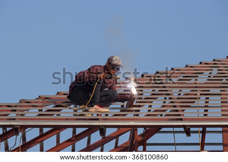 NAKHON RATCHASIMA -JAN 15 : worker welding the steel to build the roof at construction site on January 15, 2016 in Nakhon Ratchasima, Thailand