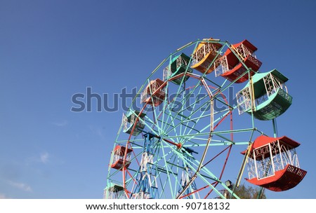 Ferris wheel Player of the fun kids with blue sky