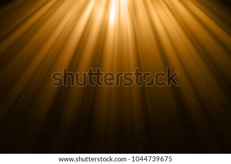 christmas gold gradient sparkle glitter dust particles from top on black background with bokeh flowing and ray light, golden holiday happy new year and valentine day love, relationship concept