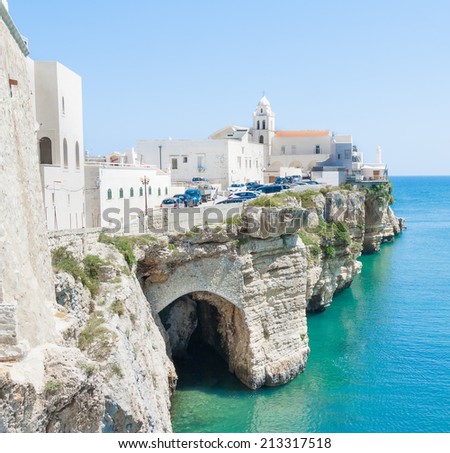 church in front of adriatic sea in the Vieste Italy with cave on sea level