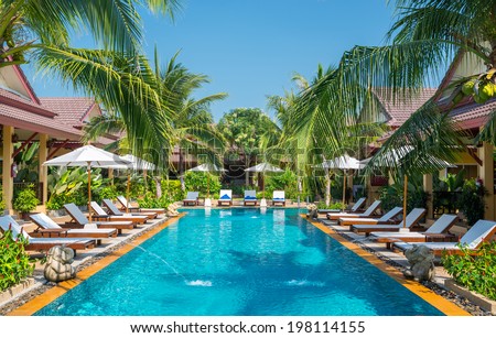 beautiful swimming pool in tropical resort , Phuket, Thailand.