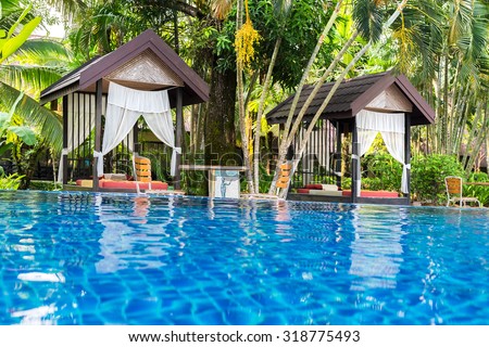 Place for Thai massage at beautiful swimming pool in tropical resort, Koh Chang island, Thailand.
