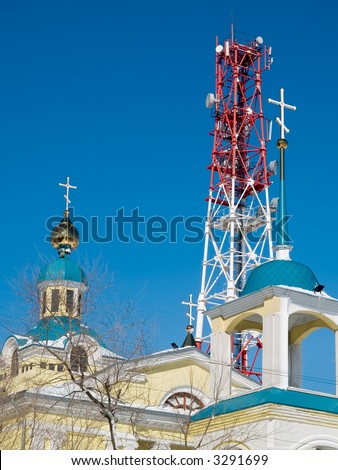 past and future - cellular tower and church