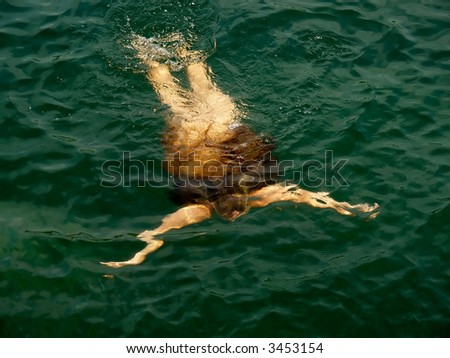 stock photo underwater silhouette of young nude woman