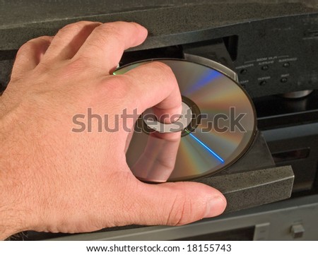 inserting blu-ray dvd disk in player