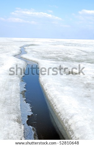 arctic solid ice landscape with track of ice-breaker ship