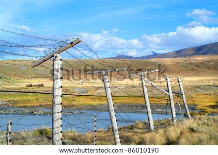 Russia China border fence at  mountain plateau Ukok, Altai