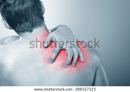 Woman With Upper Back And Neck Pain Standing Naked With Her Back