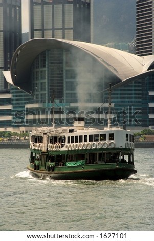 A ferry passing by Hong Kong Convention And Exhibition Centre