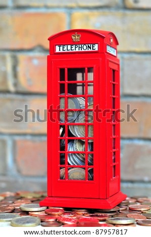 Red money box with coins