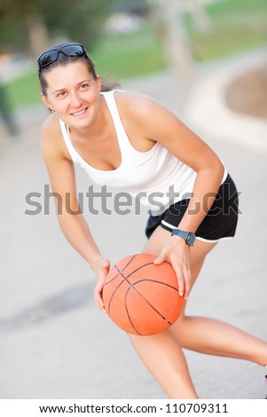 athlete with the ball played basketball in park