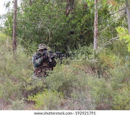 military weapons in the woods, the military conflict