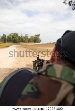 armed man with a gun in his hand, the military conflict