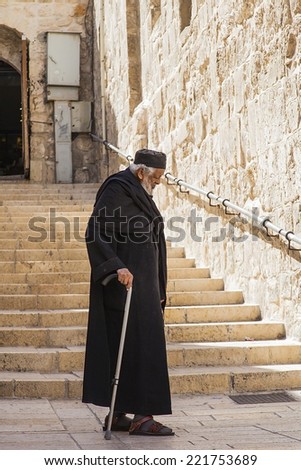 JERUSALEM/ISRAEL - 20 SEPTEMBER 2014: old monk walking down the street of Jerusalem. 20 september 2014 Jerusalem.