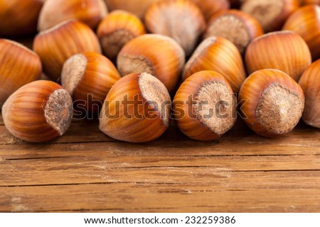 dried whole hazelnuts close-up on wooden background