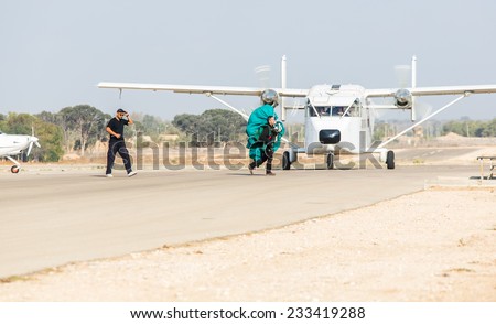 BEER-SHEVA/ISRAEL - 15 OCTOBER 2014: two men in outfit with a parachute go aerodrome. 15 october 2014 Beer-Sheva.