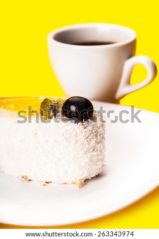 coconut of cake and coffee cup on a yellow background