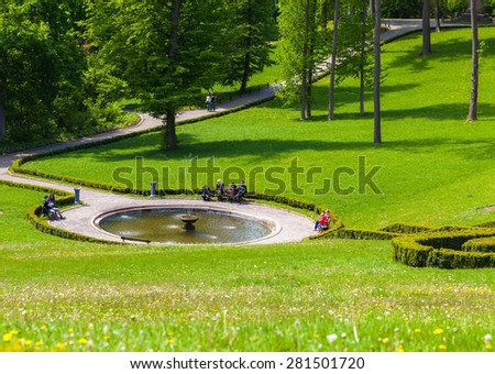 UMAN/UKRAINE - 9 may 2015: Tourists rest in a park near the fountain. 9 may Ukraine.