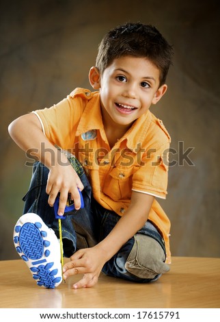 Boy is measured his foot