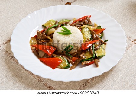 Dish from rice and meat with vegetables