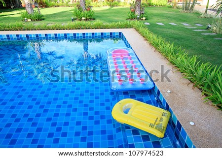 swimming pool with floatable toys in the water
