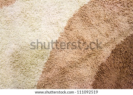 A beige carpet texture, close-up