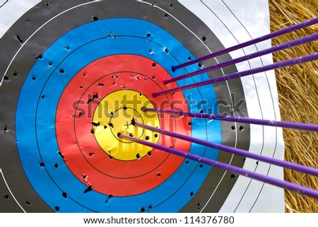 An archery target full of arrows