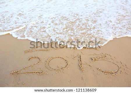 2012 and 2013 on the sand seashore - concept of new year