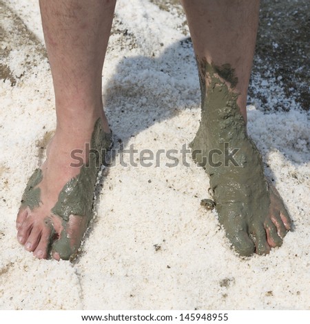 closeup of a feet playing in the mud