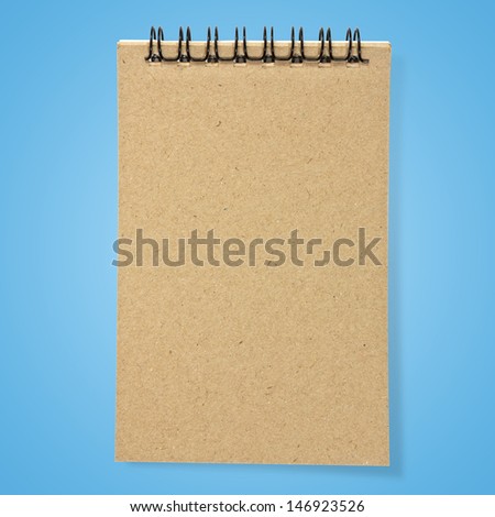 recycled paper notebook front cover on blue background