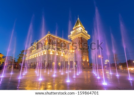 coloured jets water of fountain and the Main Guard building by night in the Venezia Huahin Thailand