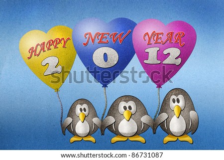Penguins happy new year 2012 recycled paper craft on paper background