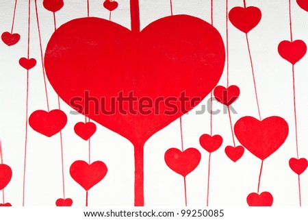 red heart painting on wall