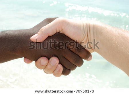 Closeup of people shaking hands black and white
