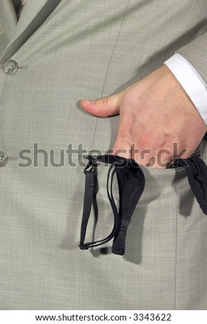 a man hides bra in the suit pocket (macho\'s secret)