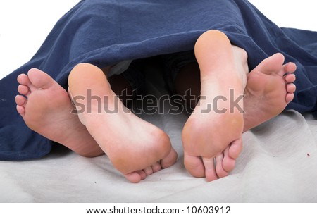 stock photo bare feet of loving caucasian couple isolated on white