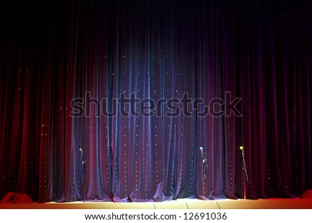 real stage curtain and microphones backdrop