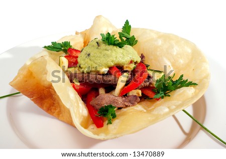 mexican style meet vegetables on cake isolated