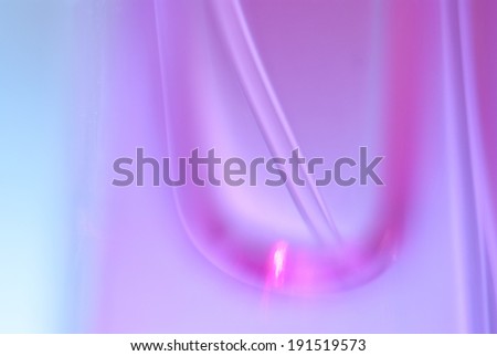 Abstract background with a macro shot of a pink tube