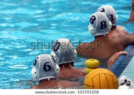 water polo players resting in a swimming pool