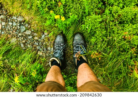Mens shoes and Carpathian mountains landscape in Romania