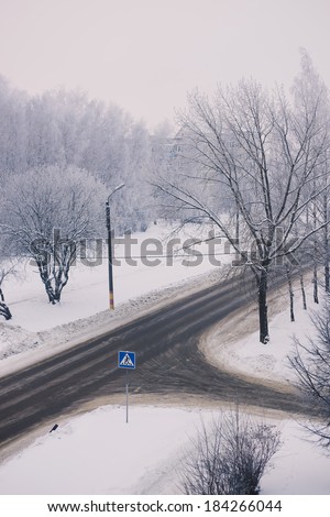 Crossroad at winter - all in snow, pedestrian crossing