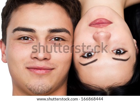 Closeup young man and woman faces. Top view.