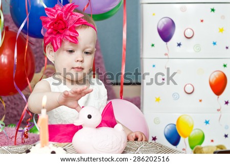 Little girl with first  birthday cake