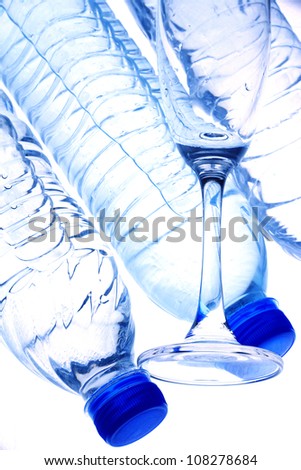 Bottles contain pure water  and glass, isolated on white