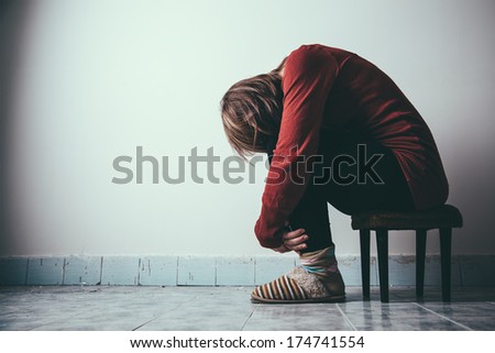 A woman sitting alone and depressed